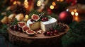 Festive Christmas cheeseboard with cheese, figs, and cranberries Royalty Free Stock Photo