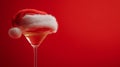 Festive Christmas Cocktail with Santa Hat on Red Background Royalty Free Stock Photo