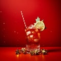 Festive christmas cocktail. Studio shot against a red background