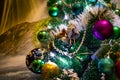 Festive Christmas composition, decorations on the Christmas tree, gift boxes, packaging and tinsel and silver beads. Toys and deco Royalty Free Stock Photo