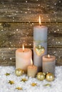 Festive christmas decoration in gold and white: four red burning