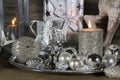 Festive christmas decoration in silver with burning candles. Royalty Free Stock Photo