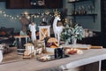 Festive Christmas decoration table with big cup of hot beverage with sugar and snack close-up Royalty Free Stock Photo