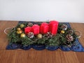 Festive Christmas decoration table with red candles, handmade work Royalty Free Stock Photo