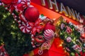 Enjoy a Festive Christmas Garland Adorned with Red Baubles, London, UK. Royalty Free Stock Photo