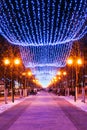 Festive Christmas New Year illuminations in city streets In Belarus. Royalty Free Stock Photo