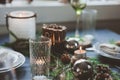 Festive Christmas and New Year table setting in scandinavian style with rustic handmade details in natural and white tones Royalty Free Stock Photo