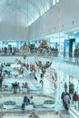 Festive Christmas shopping mall. Abstract blurred unrecognizable people, defocused background Royalty Free Stock Photo