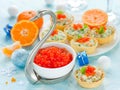 Festive Christmas table with refreshments - red caviar in a bowl Royalty Free Stock Photo