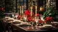 Festive Christmas table setting with crystal glasses, red poinsettias and lit candles for cozy holiday dinner. Sparkling stemware Royalty Free Stock Photo