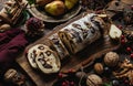 festive christmas tresor rola with nuts, berries and pears on a wooden board Royalty Free Stock Photo