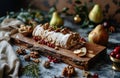 festive christmas tresor rola with nuts, berries and pears on a wooden board Royalty Free Stock Photo