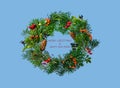 Festive Christmas wreath with rosehip, sea buckthorn, winter berry holly, mistletoe, fir and pine cones