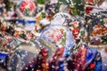 Festive cityscape - view of the Christmas decorations with Christmas crystal ball closeup on the Christmas Market