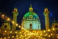 Festive cityscape - view of the Christmas Market on Karlsplatz Charles` Square and the Karlskirche St. Charles Church in the c