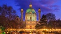 Festive cityscape - view of the Christmas Market on Karlsplatz and the Karlskirche in the city of Vienna Royalty Free Stock Photo