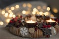 Festive closeup of burning candles of Advent wreath made from natural materials Royalty Free Stock Photo