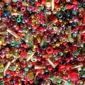 Festive colored, colorful seed beads and bugle glass mix, usable as background