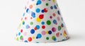Festive colorful polka dot party hat on a clean white background Royalty Free Stock Photo