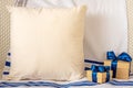 Composition with blank grey pillow and gift boxes on tallit