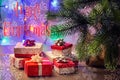 Festive composition, Christmas tree, decorative ribbons and many small gift boxes. Lots of snowflakes in blur. The Royalty Free Stock Photo