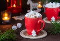 Festive composition, cocoa with star-shaped marshmallows in a red cup on a brown concrete background in Christmas style. Merry