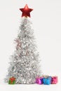 Festive composition with a silver Christmas tree and colorful gift boxes Royalty Free Stock Photo