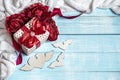 A festive composition for Valentine`s Day with a gift box, knitted element and decorative details Royalty Free Stock Photo