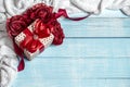 Festive composition for Valentine`s Day with gift box, knitted element and decorative roses Royalty Free Stock Photo