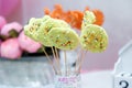 Festive cookie pops or cookies on sticks. Birthday candy bar with spring flowers for girl