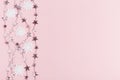 Christmas composition. Frame made of balls and snowflakes on pastel pink background. Royalty Free Stock Photo