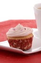 Festive cupcake with tea on fancy plate Royalty Free Stock Photo