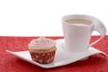 Festive cupcake with tea on fancy plate