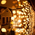 Festive dark blurred background with bokeh lights, garland and house