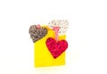 Festive decor hearts and yellow paper shopping bag on white isolated background. Royalty Free Stock Photo