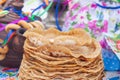 Festive decor for Maslenitsa on the table: pancakes, bagels, a samovar, a doll with ribbons. Russian folk traditions