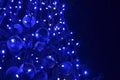 Festive decorated Christmas tree with blue led lights Royalty Free Stock Photo