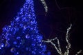 Festive decorated Christmas tree with blue led lights Royalty Free Stock Photo