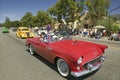 Festive decorated vintage automobile makes its way down main street during a Fourth of July parade in Ojai, CA