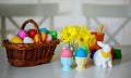 festive decoration for Easter holiday with flowers and eggs, basket full of eggs