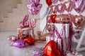 Festive decorations for Valentine's day, wedding or hen party. Love sign and heart shape balloons on white Royalty Free Stock Photo