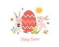 Festive decorative composition with pair of adorable lovely bunnies or rabbits decorating giant egg and Happy Easter