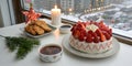 Festive dessert display with strawberry cake and chicken bites during winter snowfall Royalty Free Stock Photo