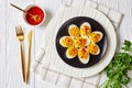 Festive devilled eggs with sriracha, flat lay