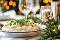 Festive dinner plate with new potatoes and fresh herbs on holiday table Royalty Free Stock Photo