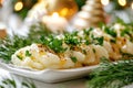 Festive dinner plate with new potatoes and fresh herbs on holiday table Royalty Free Stock Photo