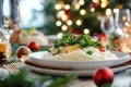Festive dinner plate with new potatoes and fresh herbs on holiday table Royalty Free Stock Photo