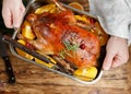 Festive duck baked with oranges, cranberries, rosemary and spice