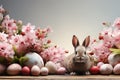 Festive Easter background with a rabbit, colorful eggs and flowers. The concept of a Happy Easter. Royalty Free Stock Photo