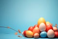 A festive Easter composition featuring pastel-colored eggs arranged on a vibrant blue background. The cheerful design Royalty Free Stock Photo